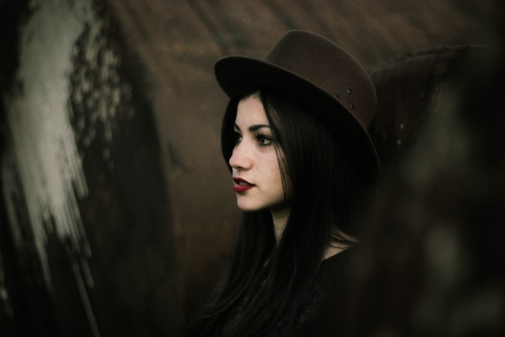 woman wearing black hat