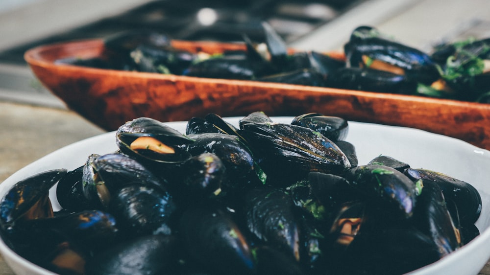 cooked mussel. in white bowl