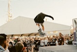 Skateboarders gathered together celebrating after a competition event.