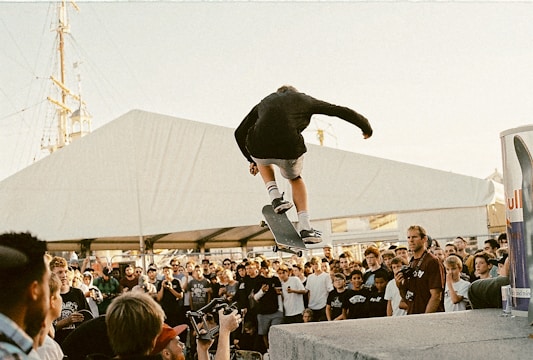 A competitive skateboard contest with participants and spectators.