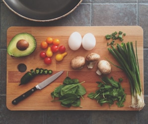 avocado, tomatoes, eggs, mushrooms, spring onions, and leaves