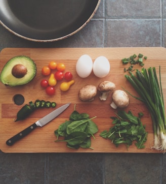 avocado, tomatoes, eggs, mushrooms, spring onions, and leaves