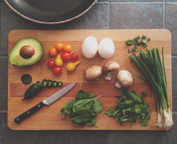 avocado, tomatoes, eggs, mushrooms, spring onions, and leaves