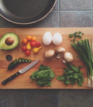 avocado, tomatoes, eggs, mushrooms, spring onions, and leaves