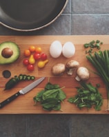 avocado, tomatoes, eggs, mushrooms, spring onions, and leaves