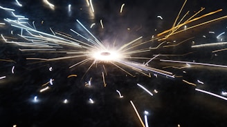 A vibrant mango bursting with colorful sparks against a clean white background.
