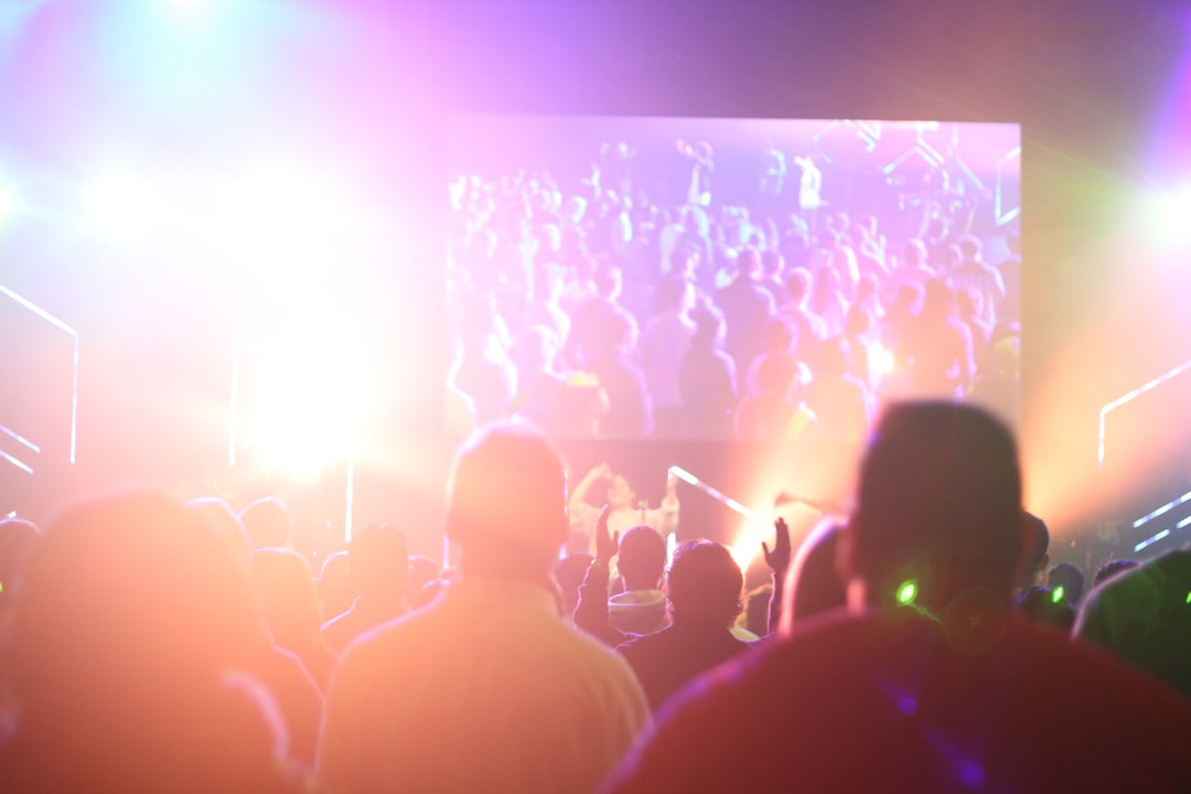 group of people having a party inside dark room with light effects