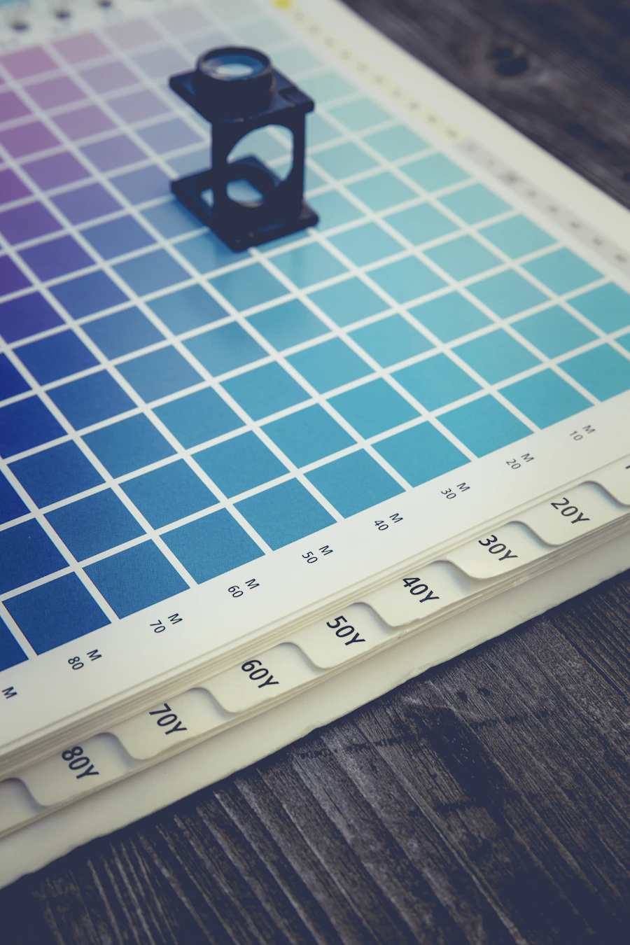 Graphic design color reference chart on a work surface