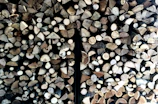 Close-up of wooden pellets neatly piled in a rustic storage.