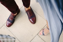 woman standing near man on beige tiled floor