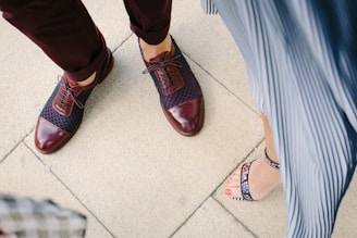 woman standing near man on beige tiled floor
