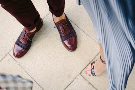woman standing near man on beige tiled floor