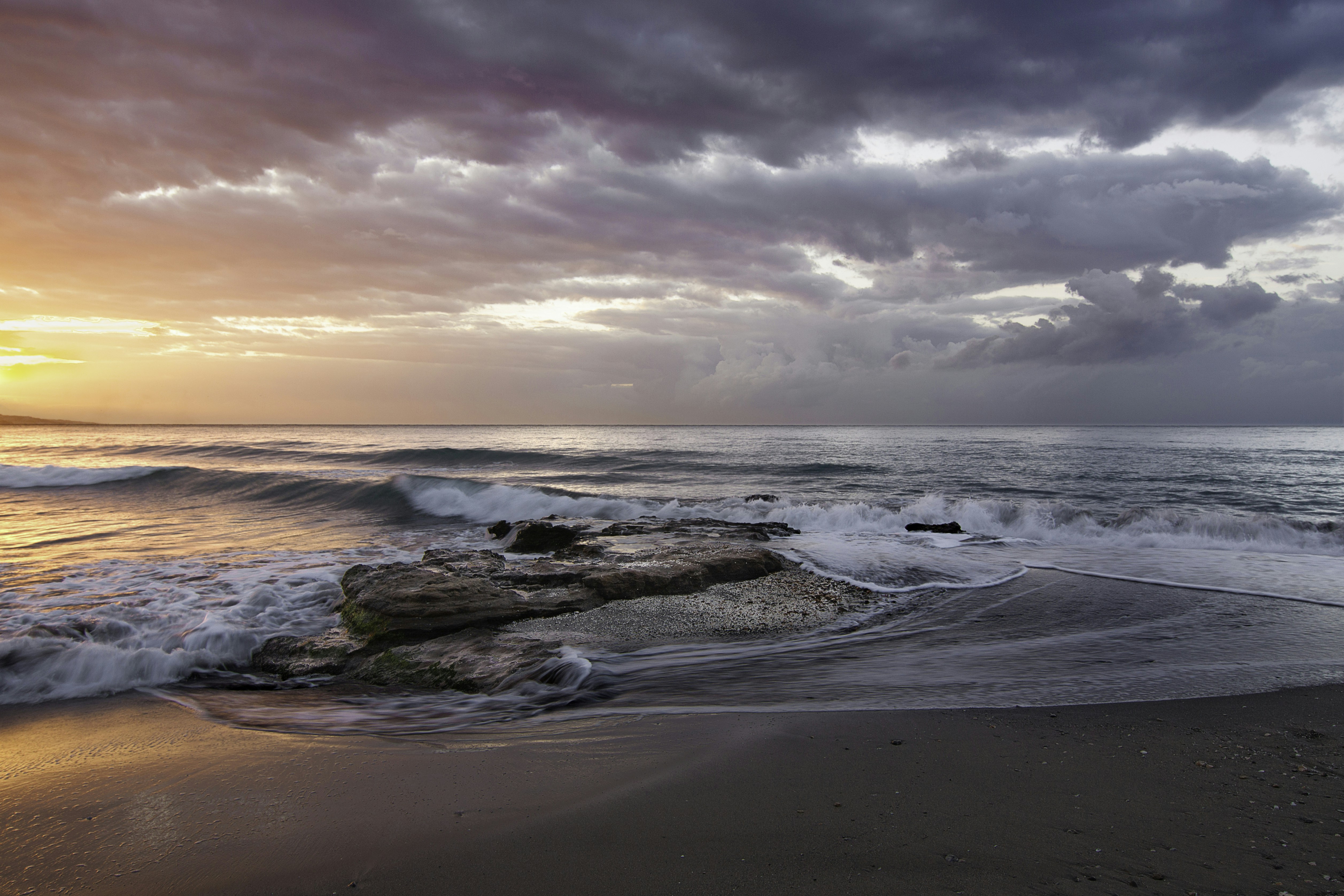 Stormy orange beach sunrise