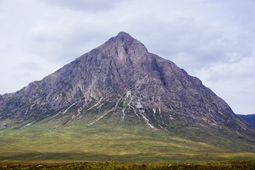 gray mountain under gray sky during daytime