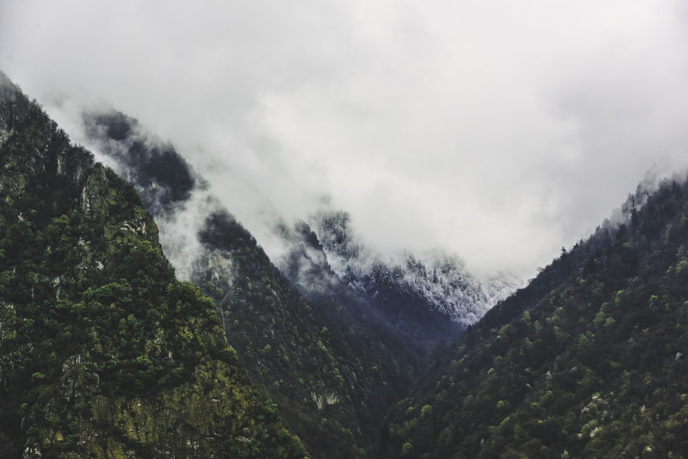 green mountains with cloudy sky