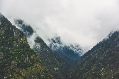 green mountains with cloudy sky