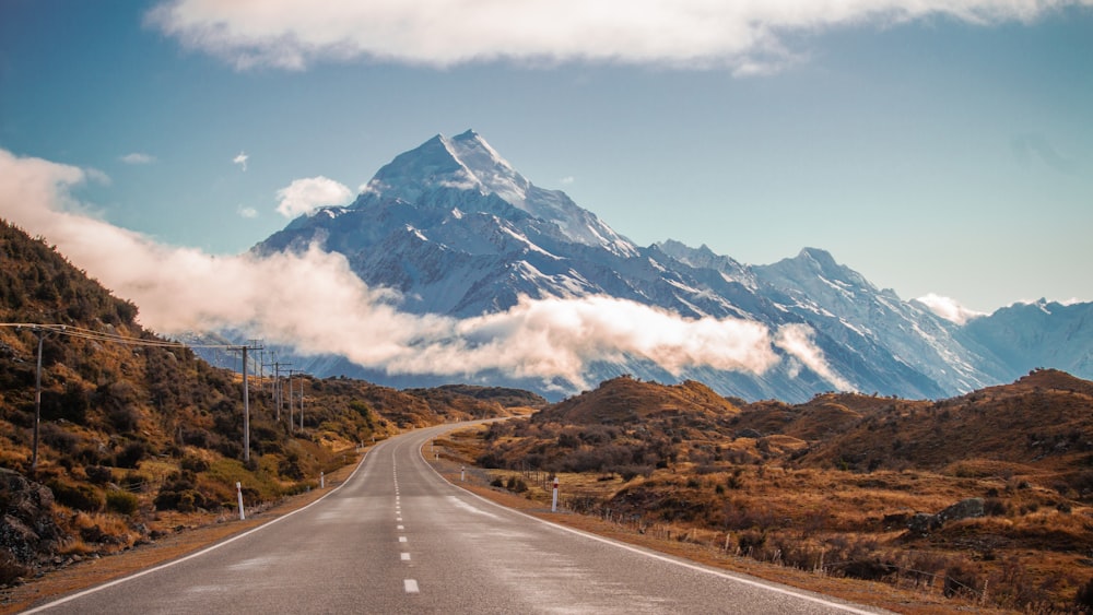 grey road in behind mountain