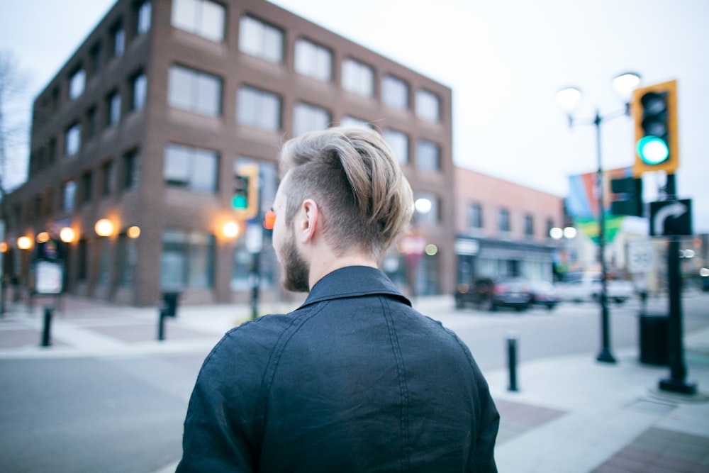 man standing on street