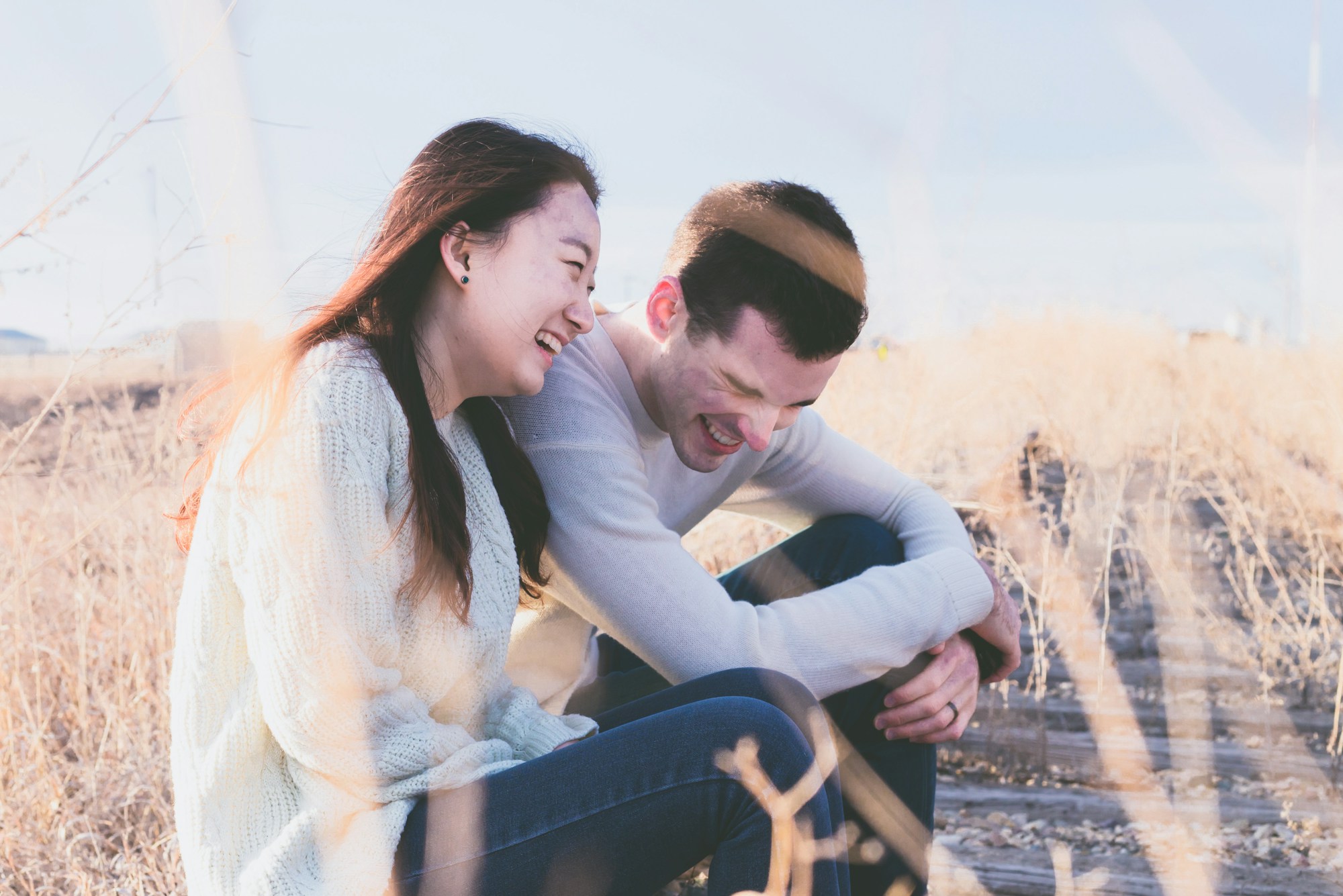 Couple laughing together outdoors