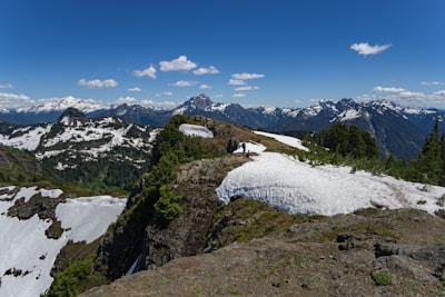 A scenic view of the northern mountains of Pakistan with travelers enjoying the landscape.
