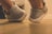 Close-up of hands trying on comfortable casual shoes in a bright retail space