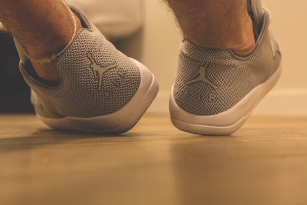 Close-up of comfortable casual shoes on a rustic wooden floor