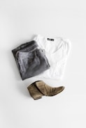 A pair of classic men's pants displayed on a minimalist background.