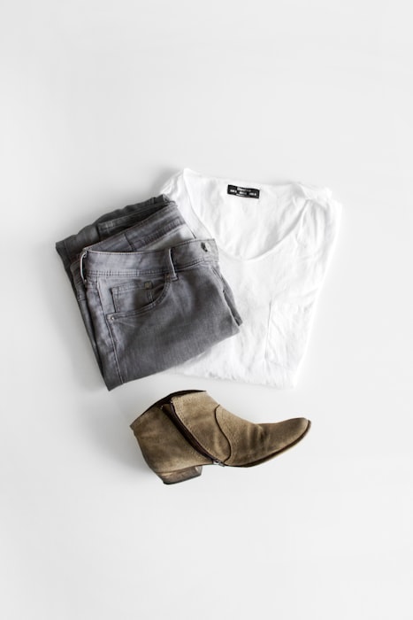 Carefully folded garments in a minimal, considered wardrobe