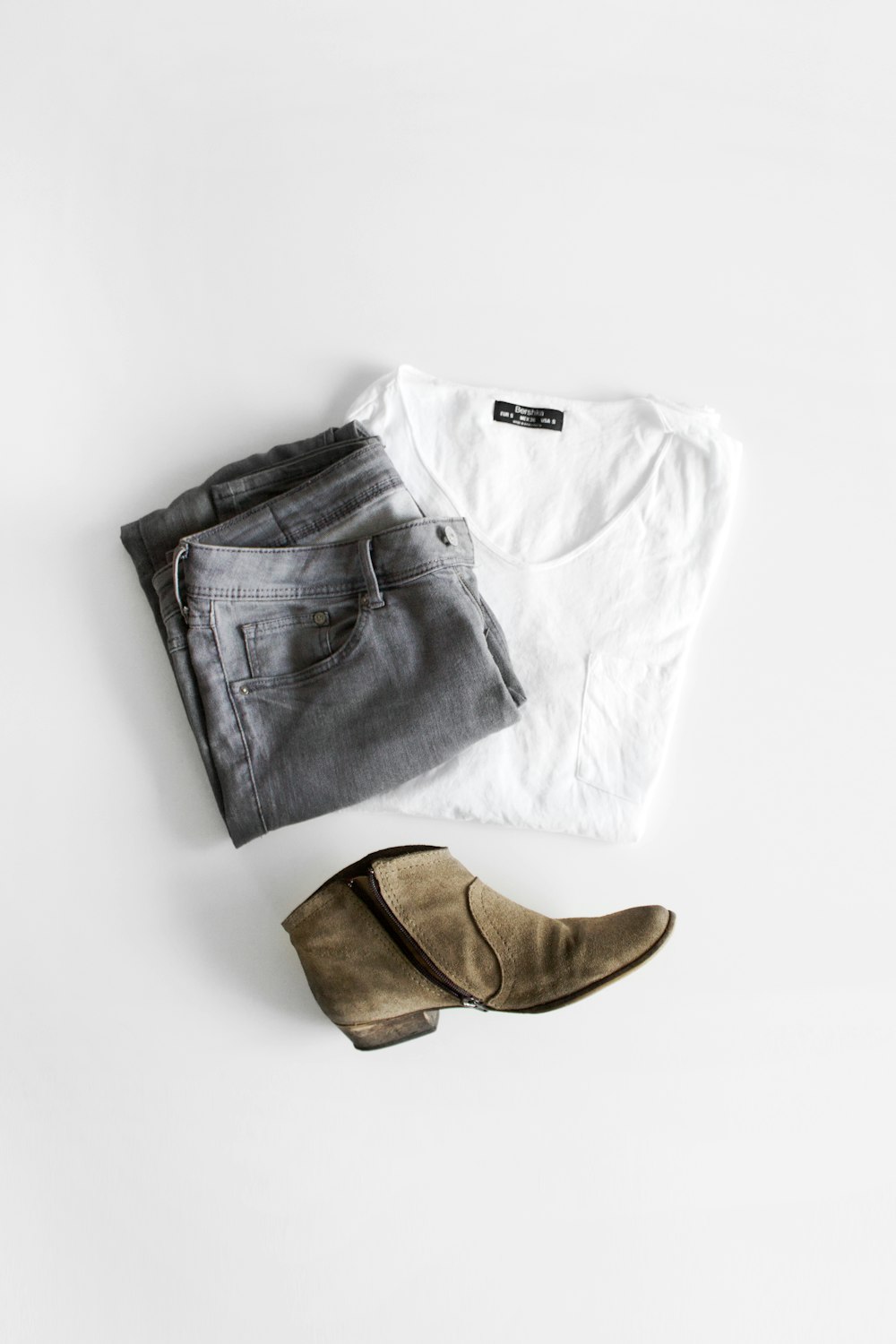white crew neck t-shirt and brown leather boots