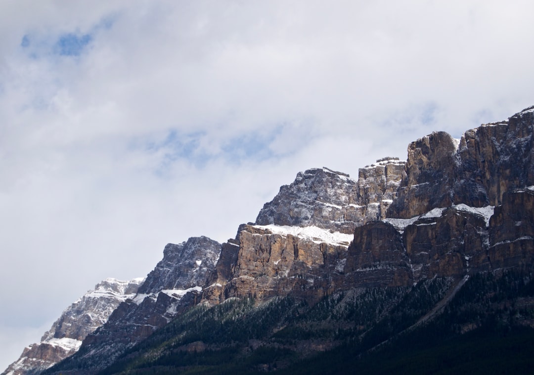 brown mountain under gray sky during daytime