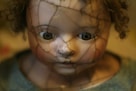selective focus photography of porcelain doll