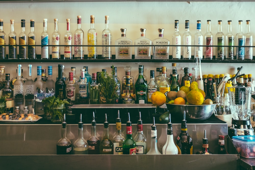 clear glass bottles on shelf