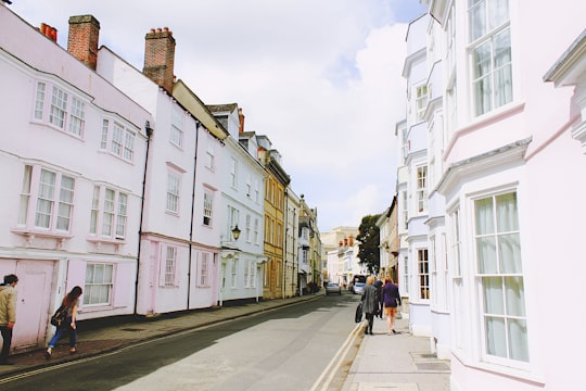 people walking on sidewalk beside building and road in Oxford United Kingdom