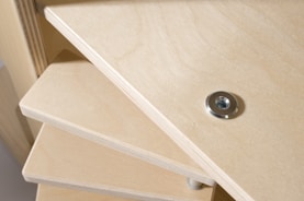 A skilled carpenter installing custom wooden shelves