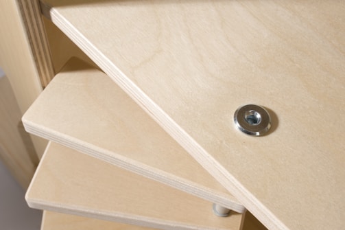 Detail of expert carpentry work on custom wooden shelving.