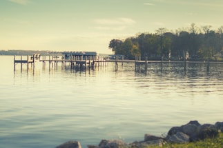 A serene lakeside view with a small boat dock.