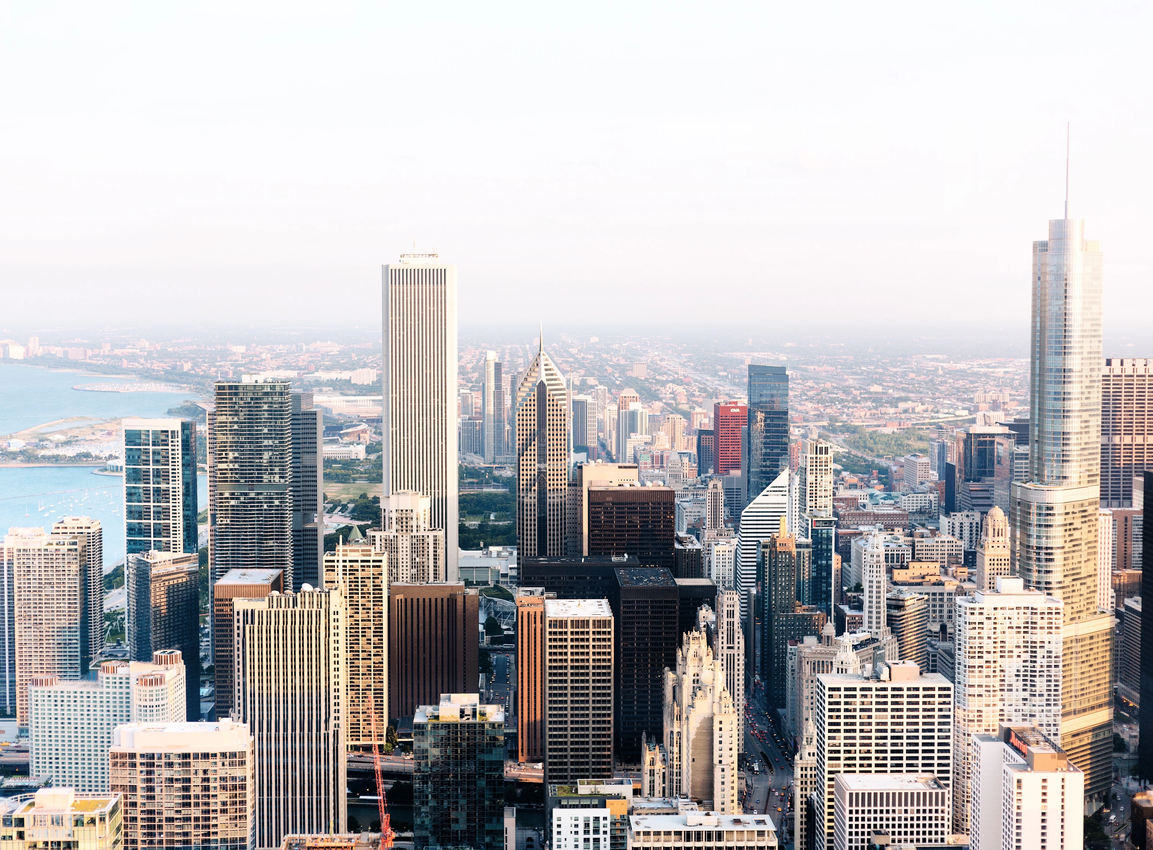 Chicago's downtown towers from above, the lake stretching away behind them