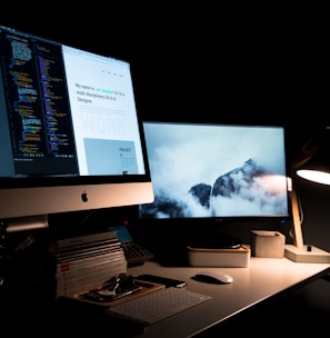 silver iMac turned on inside room