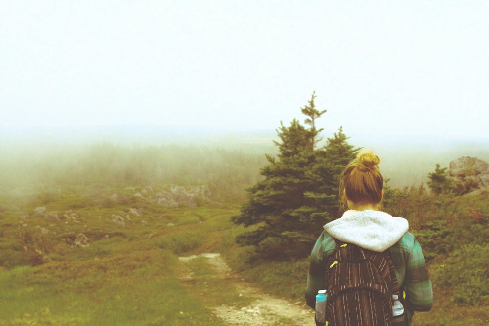 woman wearing green plaid hoodie