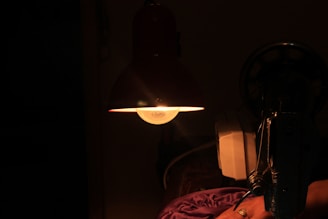 Dimly lit room featuring the Van de Graaff generator softly illuminating its surroundings.
