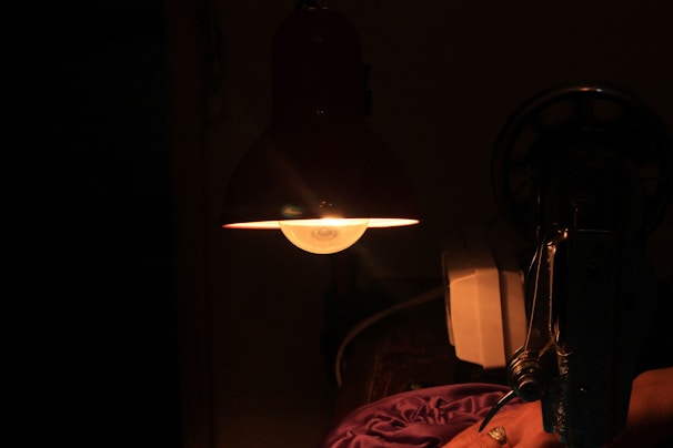 Dimly lit room featuring the Van de Graaff generator softly illuminating its surroundings.