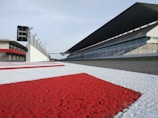 red and white race way near concrete building
