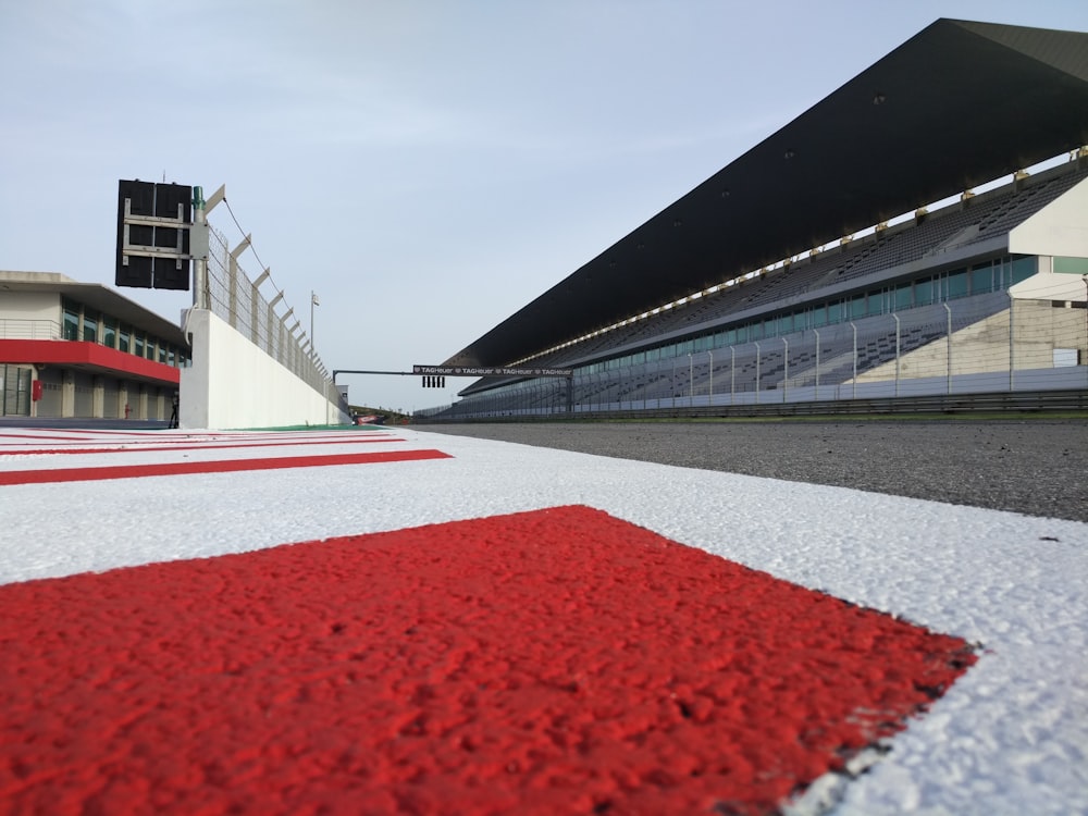 red and white race way near concrete building