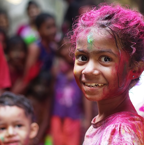 selective focus photo of girl in shirt smiling