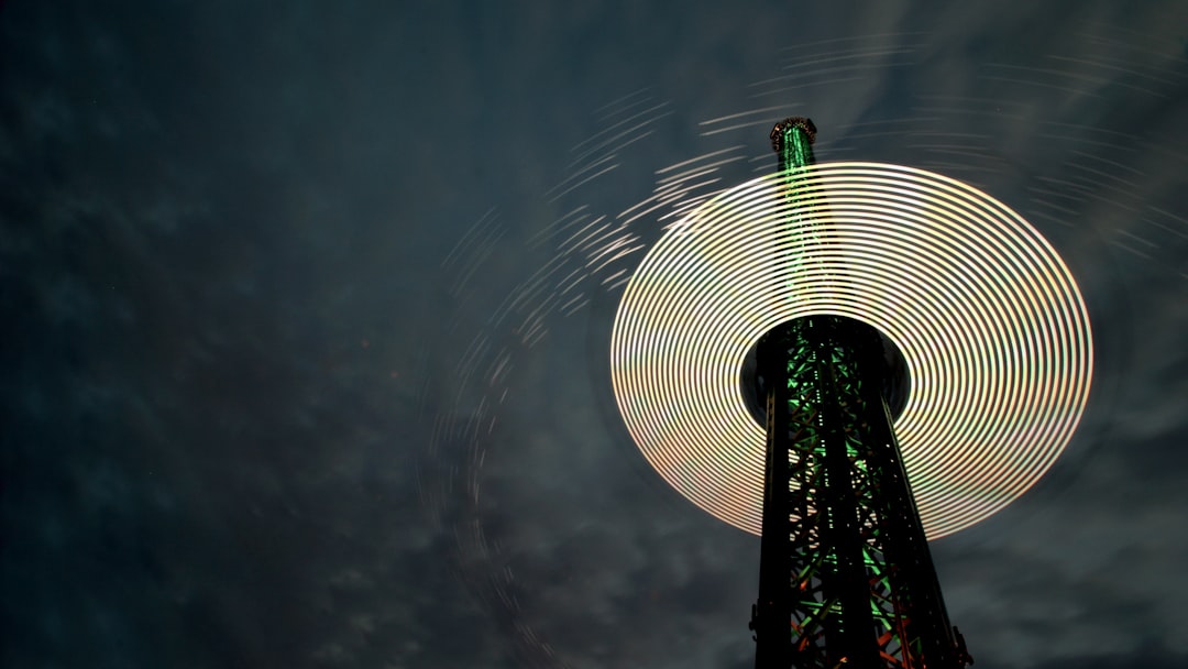 An image of the Prater Tower with a cloudy night sky as the backdrop