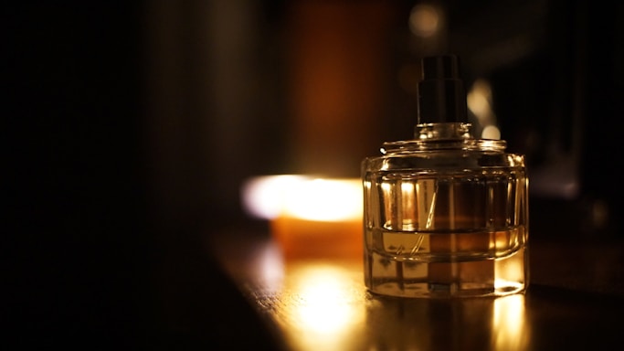A serene image of a luxurious fragrance bottle with soft lighting.
