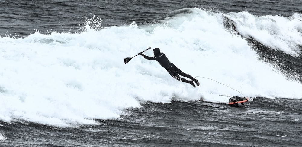 man riding surfboard