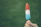 Close-up of a hand holding a fruit popsicle shaped like a star with fresh fruit pieces