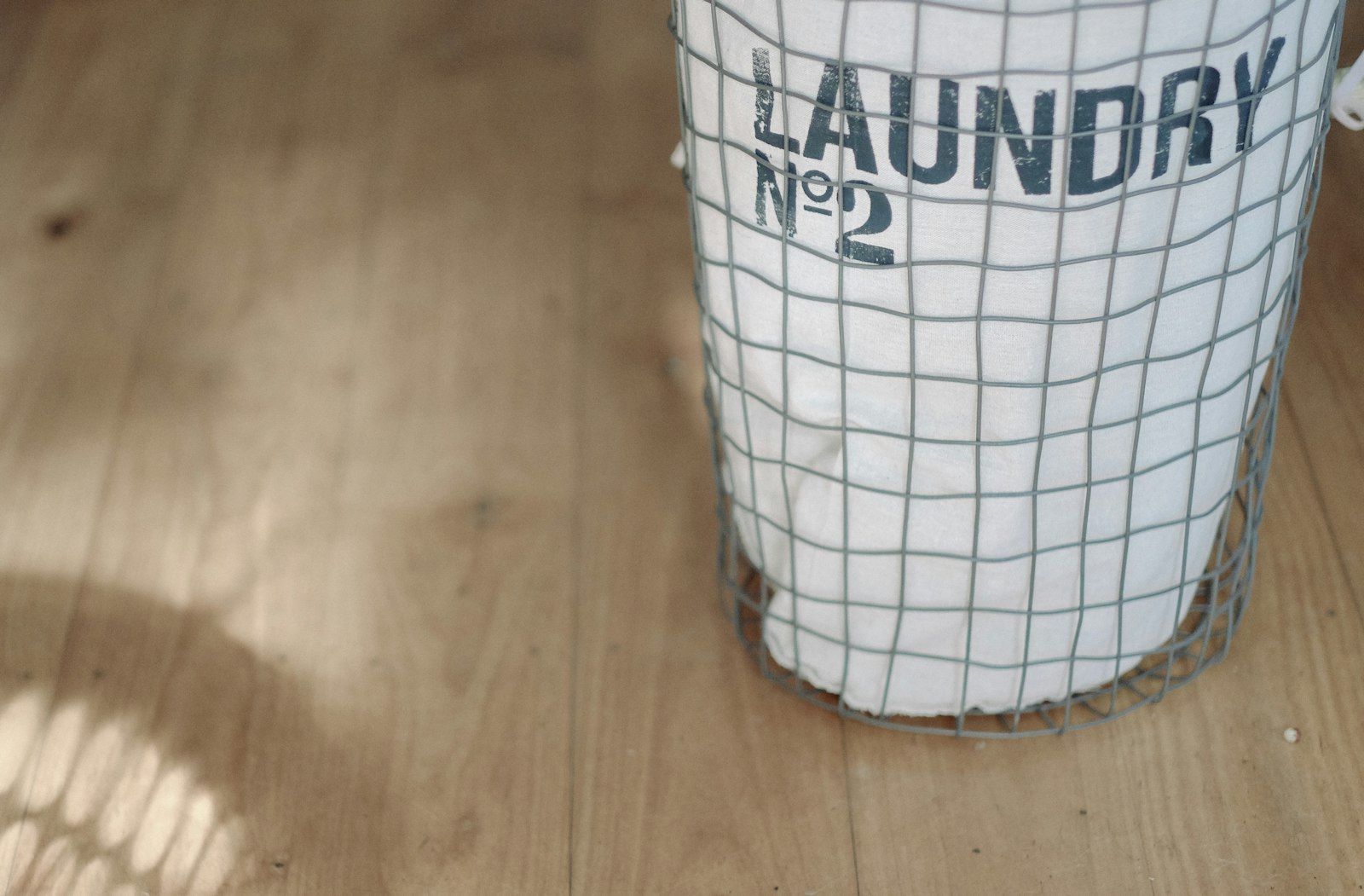 Fujifilm X-M1 sample photo. White laundry basket on photography