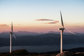 two white wind turbines